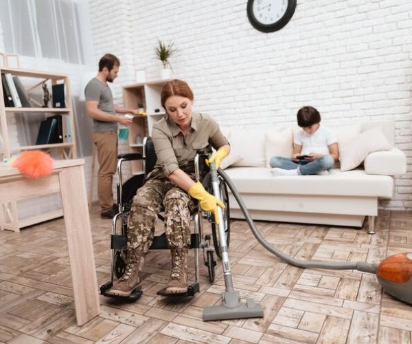 female-veteran-wheelchair-is-cleaning-house_85574-9908